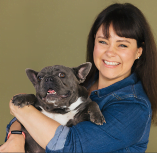 a happy French bulldog and their mom smile 